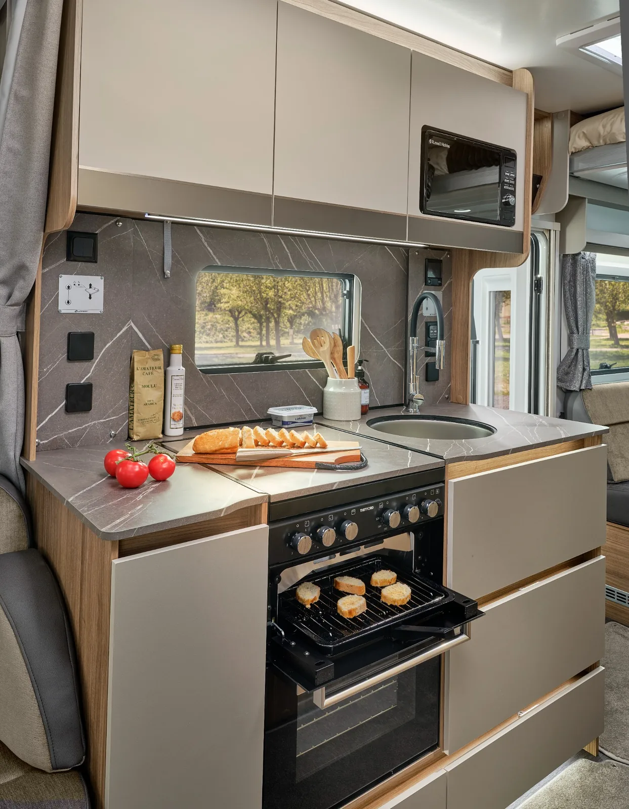 Bailey Autograph 81-5 kitchen with Thetford oven grill and dual-fuel hob