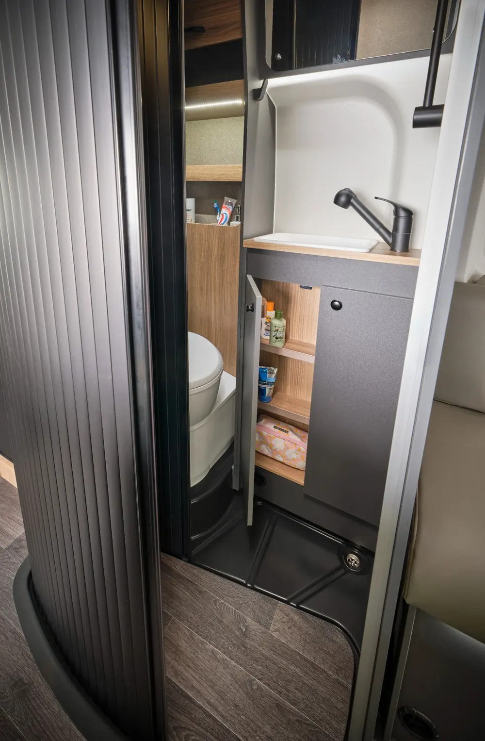 Bailey Endurance E62 full onboard washroom with space-saving tambour door