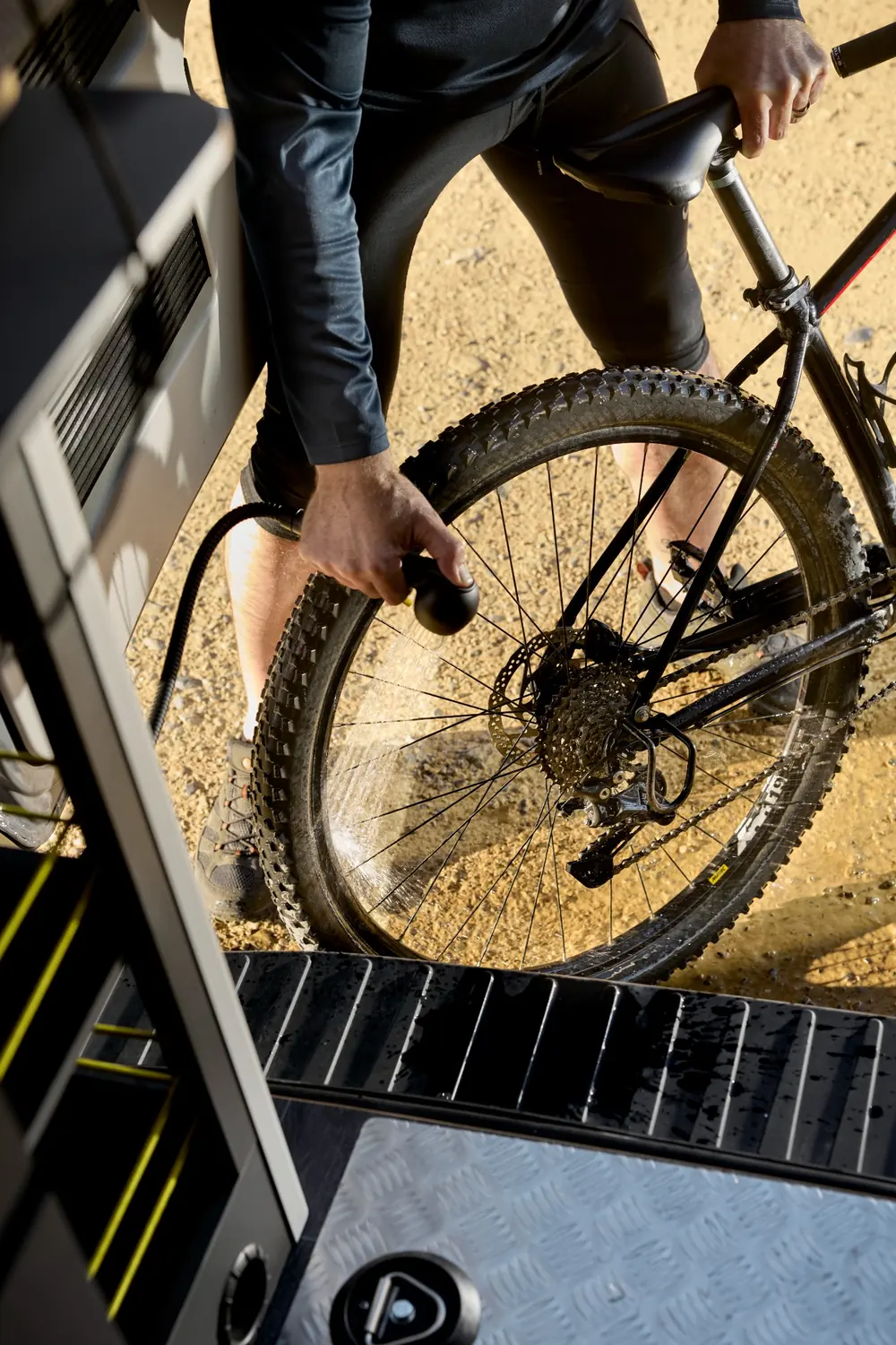 Bailey Endurance E65 cold-water shower point being used to clean a mountain bike