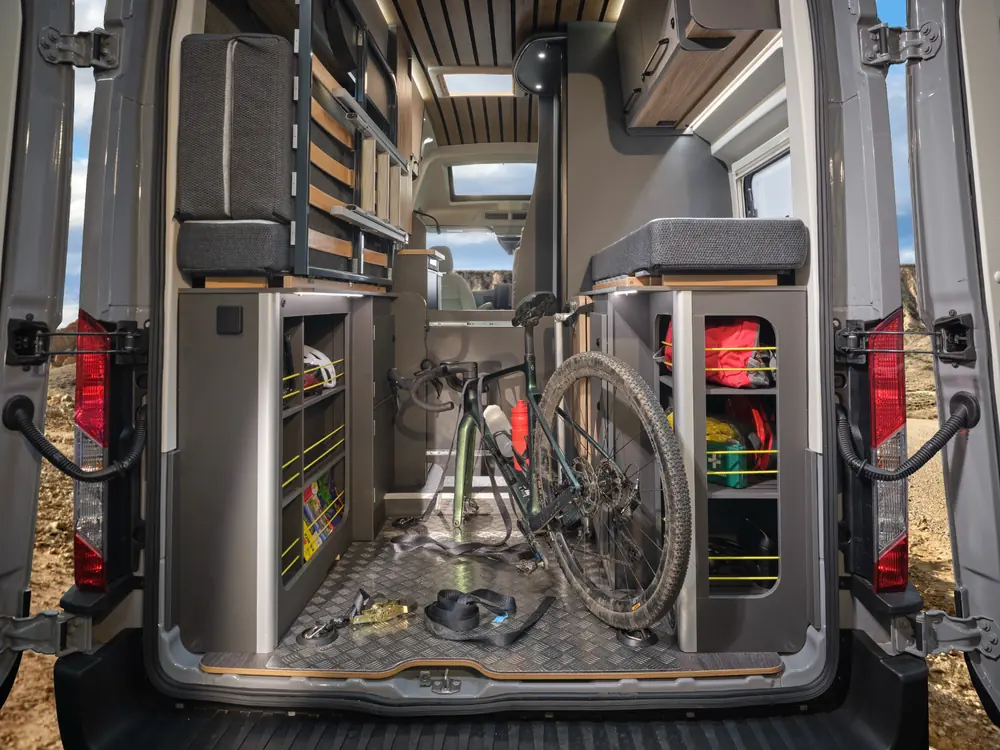 Bailey Endurance E65 rear garage carrying a bicycle with storage and lashing points