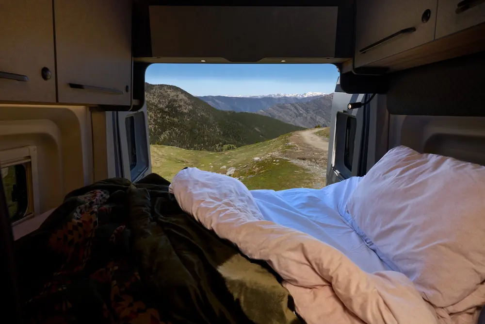 Bailey Endurance E65 fold-away transverse bed with view through rear doors