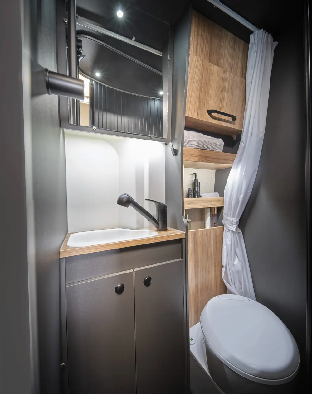 Bailey Endurance E65 onboard washroom with space-saving tambour door