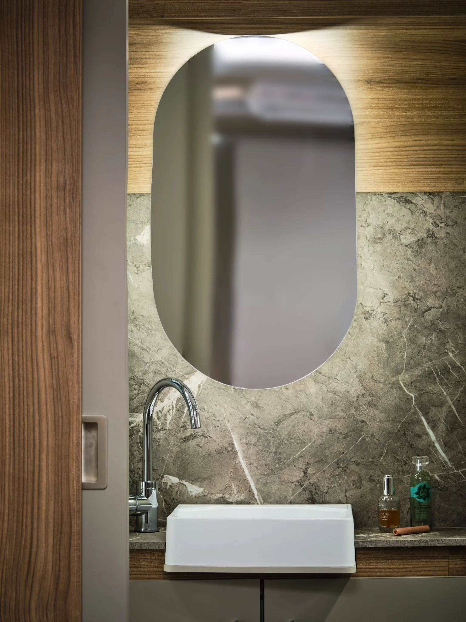 Washbasin mirror and storage in the Bailey Unicorn Grande Villena rear washroom