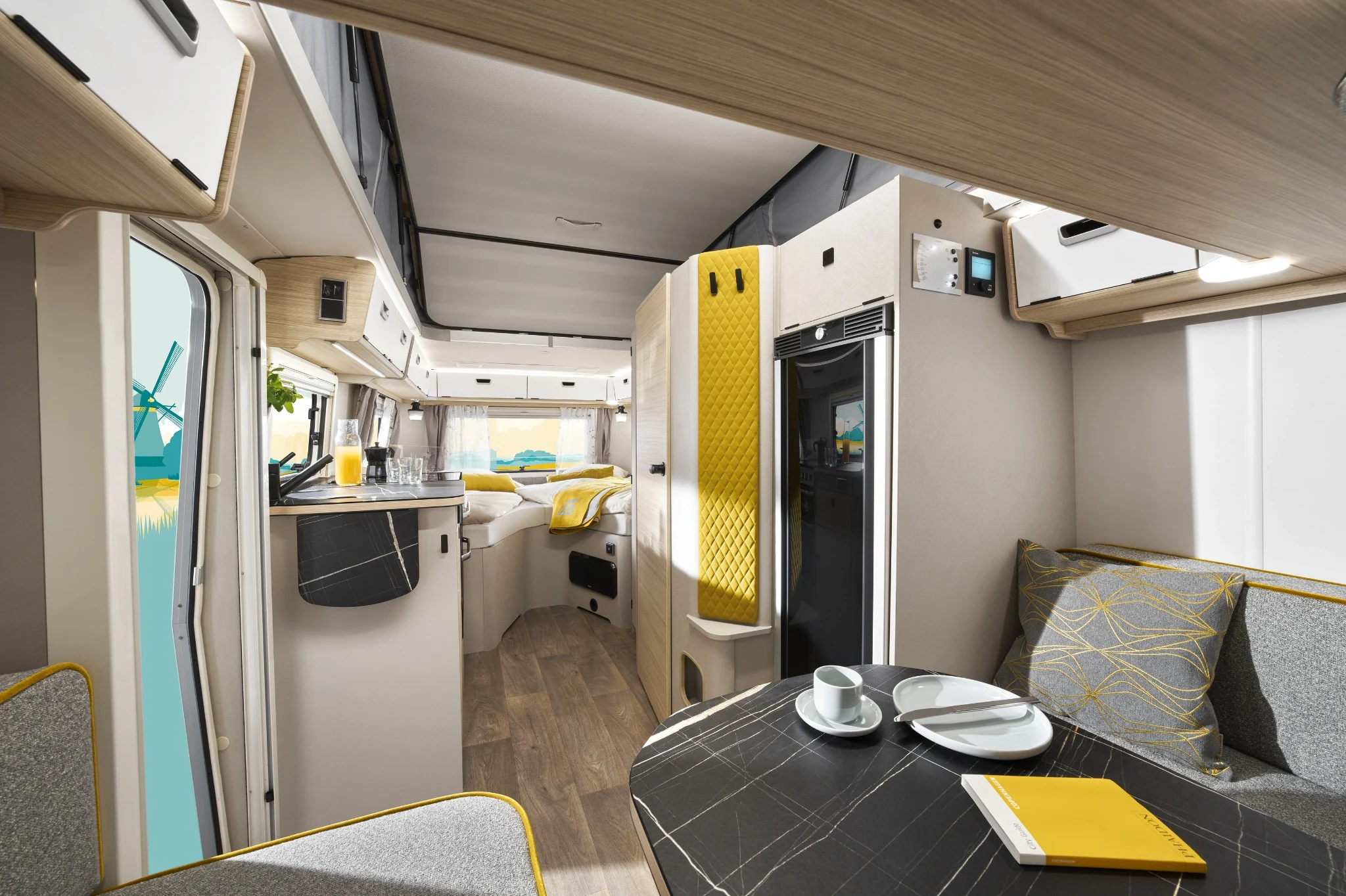 Interior of ERIBA Touring 642 showing front lounge kitchen and rear double bed